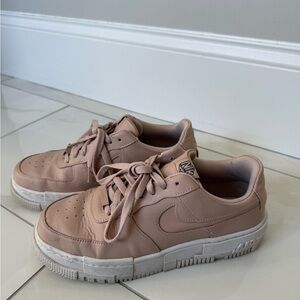 Light pink women’s Nike Air Force Ones Sneakers